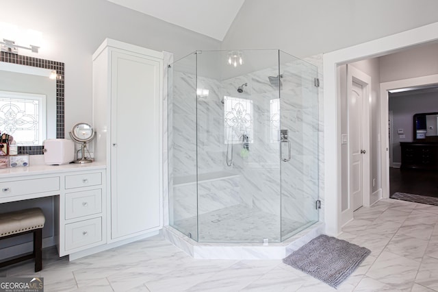 1365 Ivy Plantation, Monroe, GA 30656 - bathroom featuring marble look tiles, a marble finish shower, lofted ceiling, and vanity