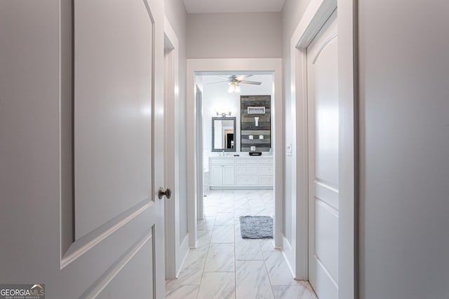 1365 Ivy Plantation, Monroe, GA 30656 - hallway featuring light marble finish flooring and baseboards