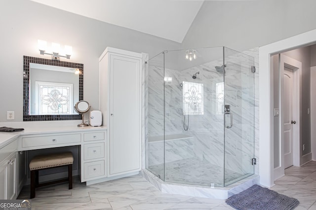 1365 Ivy Plantation, Monroe, GA 30656 - bathroom featuring marble look tile flooring, a marble finish shower, vanity, and vaulted ceiling