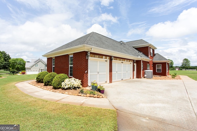 1365 Ivy Plantation, Monroe, GA 30656 - view of front of property with cooling unit, driveway, brick siding, a garage, and a front lawn