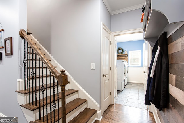 1365 Ivy Plantation, Monroe, GA 30656 - staircase featuring washer and dryer, ornamental molding, wood finished floors, and baseboards