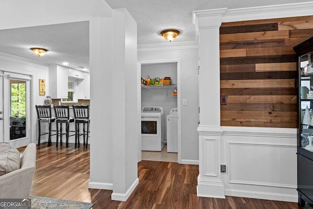 226 Le Paradis Blvd, Sharpsburg, GA 30277 - hall featuring separate washer and dryer, dark wood-style flooring, crown molding, baseboards, and a textured ceiling