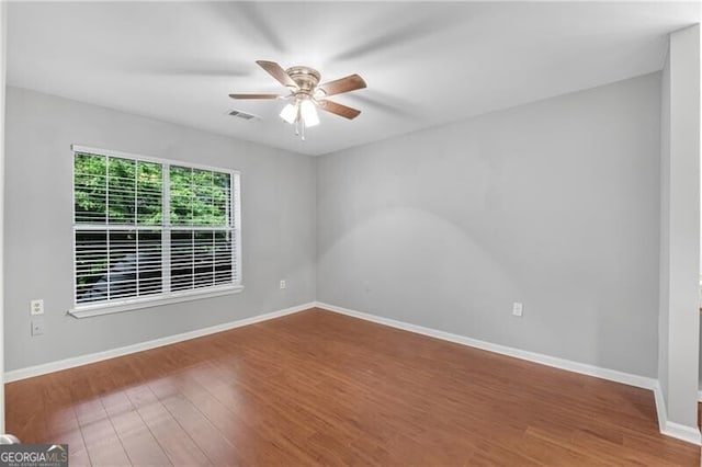 3655 Habersham Rd NE Unit 244B, Atlanta, GA 30305 - unfurnished room featuring a ceiling fan, wood finished floors, and baseboards