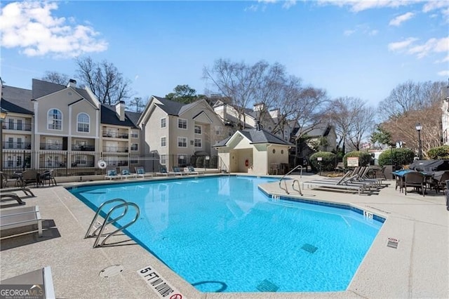 3655 Habersham Rd NE Unit 244B, Atlanta, GA 30305 - community pool with fence, a residential view, and a patio