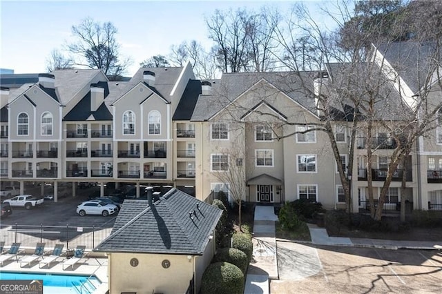 3655 Habersham Rd NE Unit 244B, Atlanta, GA 30305 - view of property featuring uncovered parking