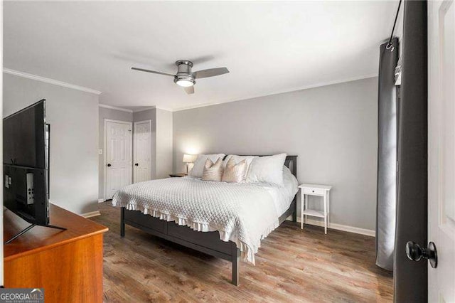 1140 Moorestown Cir, Decatur, GA 30033 - bedroom featuring ornamental molding, wood finished floors, baseboards, a ceiling fan, and a closet