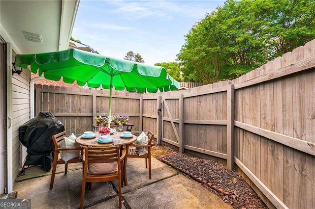 1140 Moorestown Cir, Decatur, GA 30033 - fenced backyard featuring outdoor dining area, a patio area, and area for grilling