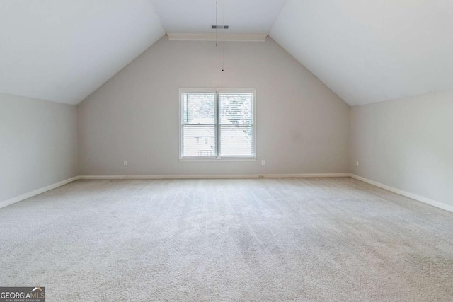 bonus room featuring baseboards, vaulted ceiling, and carpet flooring