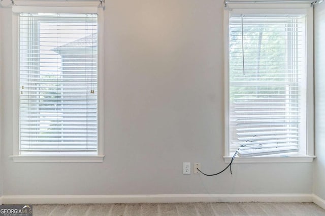 detailed view of baseboards and carpet floors