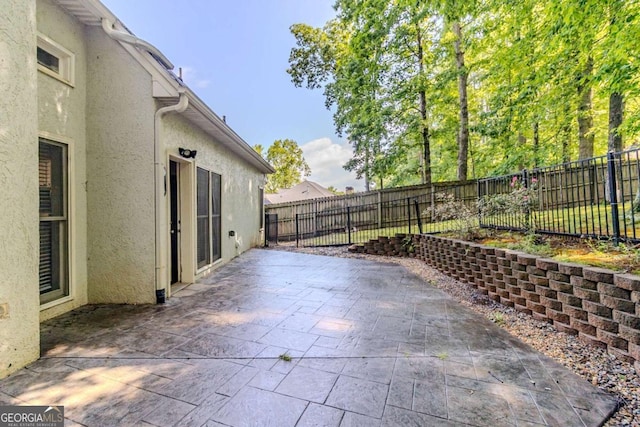 5335 Lexington View Pl, Sugar Hill, GA 30518 - fenced backyard featuring a patio area