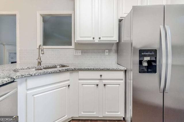 5335 Lexington View Pl, Sugar Hill, GA 30518 - kitchen featuring stainless steel appliances, backsplash, white cabinetry, and light stone counters