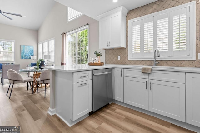 222 Harmony Ct, Alpharetta, GA 30004 - kitchen featuring dishwasher, a sink, light countertops, white cabinets, and light wood-style flooring