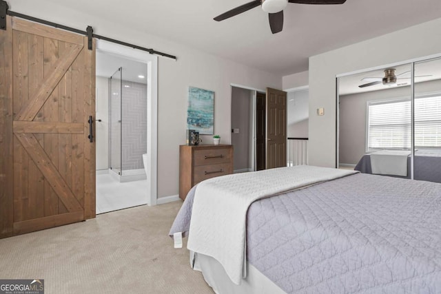 222 Harmony Ct, Alpharetta, GA 30004 - bedroom with a barn door, light carpet, a ceiling fan, ensuite bath, and baseboards