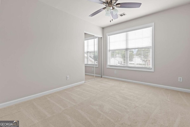 222 Harmony Ct, Alpharetta, GA 30004 - unfurnished bedroom featuring carpet floors, baseboards, and a ceiling fan