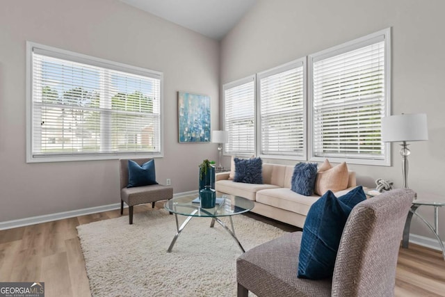 222 Harmony Ct, Alpharetta, GA 30004 - living area featuring wood finished floors, vaulted ceiling, and baseboards