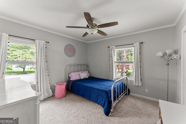 bedroom with ornamental molding, light carpet, a ceiling fan, and baseboards