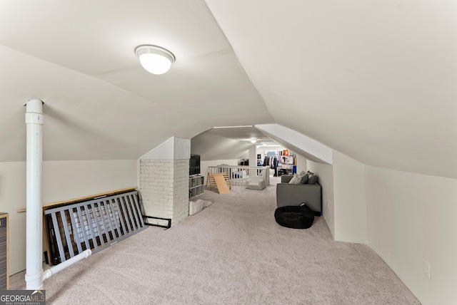 bonus room with carpet floors and lofted ceiling