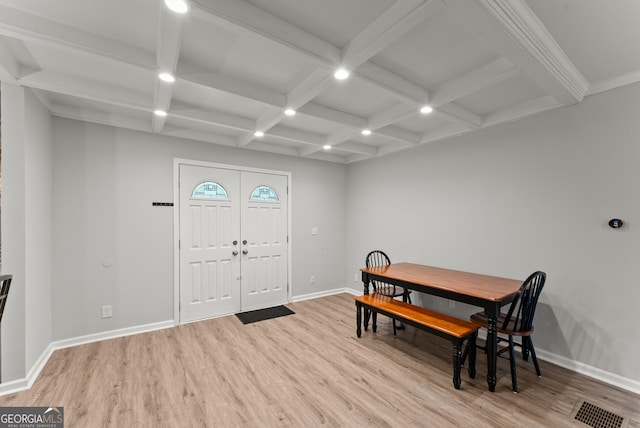 foyer entrance with light wood finished floors, beam ceiling, baseboards, coffered ceiling, and recessed lighting