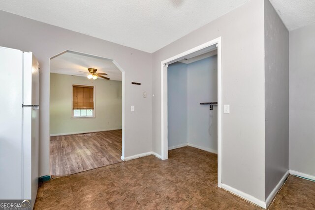1405 Lumpkin County Pkwy, Dahlonega, GA 30533 - corridor with arched walkways, carpet, baseboards, and a textured ceiling