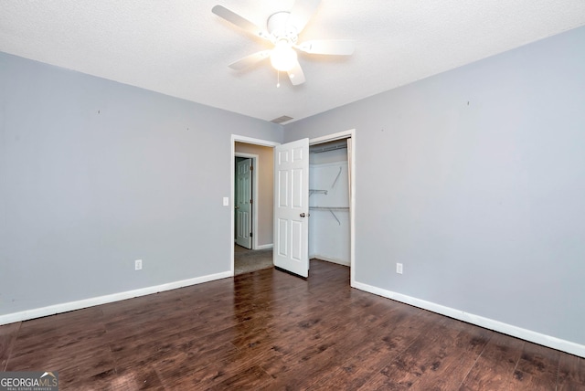 1405 Lumpkin County Pkwy, Dahlonega, GA 30533 - unfurnished bedroom with wood finished floors, baseboards, a closet, and a ceiling fan