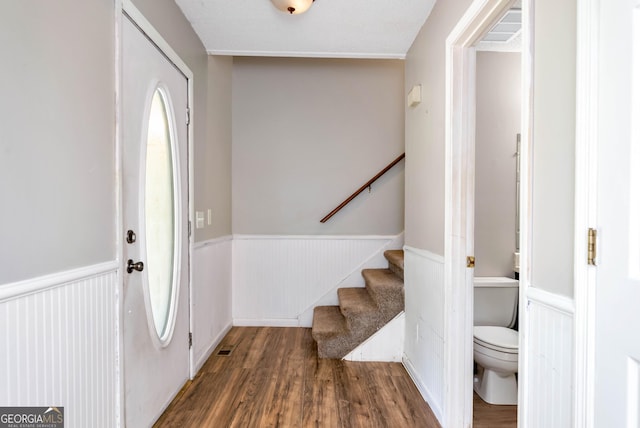 1405 Lumpkin County Pkwy, Dahlonega, GA 30533 - foyer entrance featuring a wainscoted wall, wood finished floors, and stairs