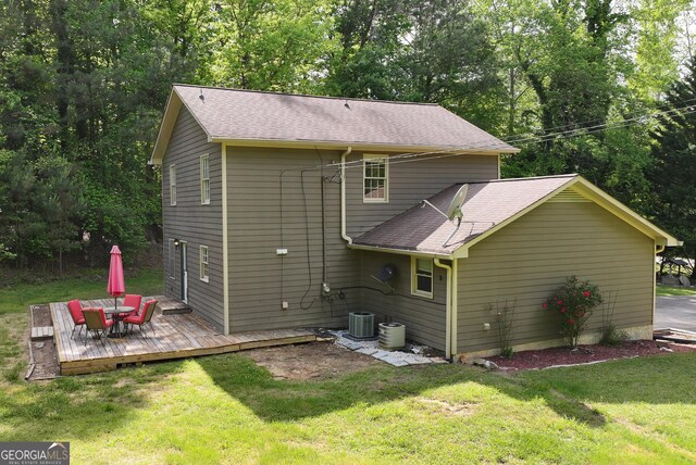 1405 Lumpkin County Pkwy, Dahlonega, GA 30533 - rear view of property featuring a wooden deck, central air condition unit, a yard, and roof with shingles