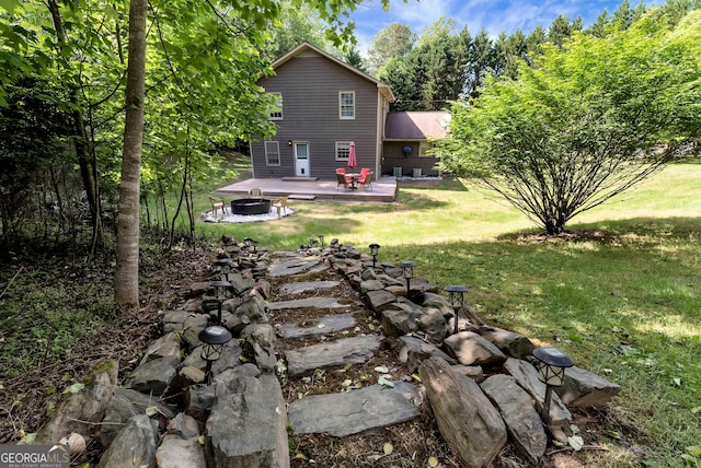 1405 Lumpkin County Pkwy, Dahlonega, GA 30533 - view of green lawn with an outdoor fire pit and a deck