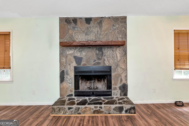 1405 Lumpkin County Pkwy, Dahlonega, GA 30533 - detailed view of baseboards, wood finished floors, and a fireplace