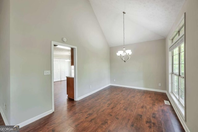 616 Lone Oak Ct, Lithonia, GA 30058 - spare room with a chandelier, dark wood-style flooring, baseboards, high vaulted ceiling, and a smoke detector