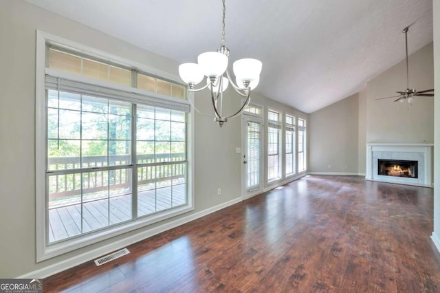 616 Lone Oak Ct, Lithonia, GA 30058 - unfurnished dining area with a chandelier, baseboards, lofted ceiling, wood finished floors, and a lit fireplace