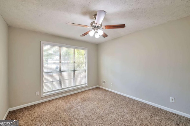 616 Lone Oak Ct, Lithonia, GA 30058 - carpeted empty room with baseboards, ceiling fan, and a textured ceiling