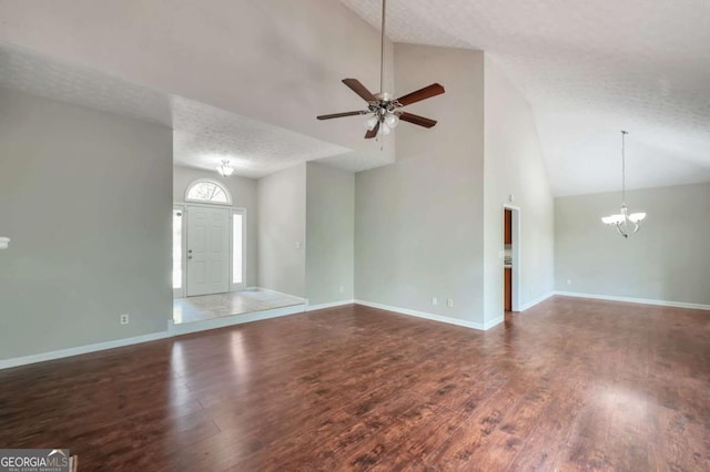 616 Lone Oak Ct, Lithonia, GA 30058 - unfurnished living room featuring a chandelier, high vaulted ceiling, wood finished floors, ceiling fan, and baseboards