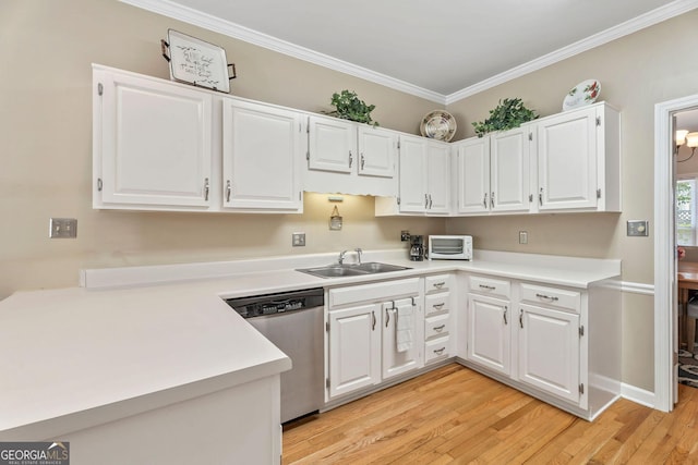 1201 Bridle Path, Marietta, GA 30068 - kitchen with stainless steel dishwasher, a sink, light countertops, light wood-style floors, and crown molding