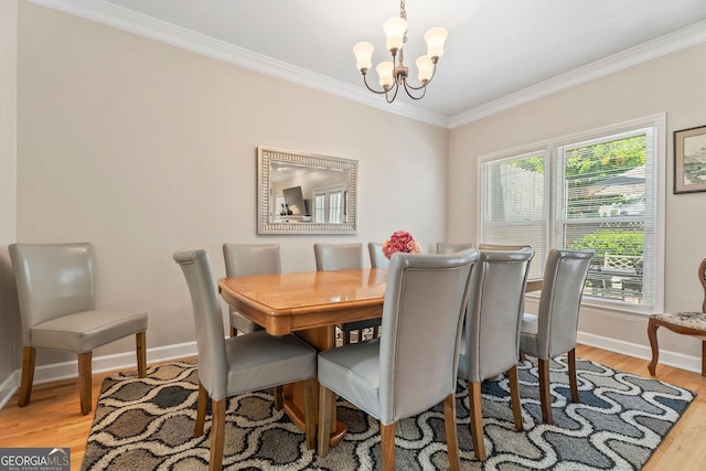 1201 Bridle Path, Marietta, GA 30068 - dining room featuring crown molding, a chandelier, baseboards, light wood-type flooring, and healthy amount of natural light