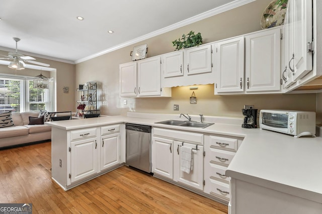 1201 Bridle Path, Marietta, GA 30068 - kitchen featuring stainless steel dishwasher, a sink, a peninsula, ornamental molding, and light countertops
