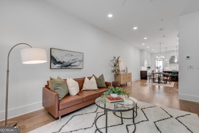 574 Boulevard Pl NE Unit 4, Atlanta, GA 30308 - living room with recessed lighting, baseboards, wood finished floors, and a chandelier