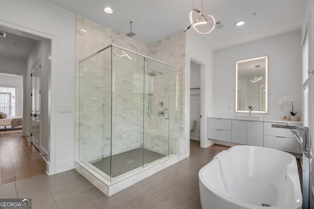574 Boulevard Pl NE Unit 4, Atlanta, GA 30308 - full bathroom with a shower stall, recessed lighting, tile patterned floors, a freestanding tub, and baseboards