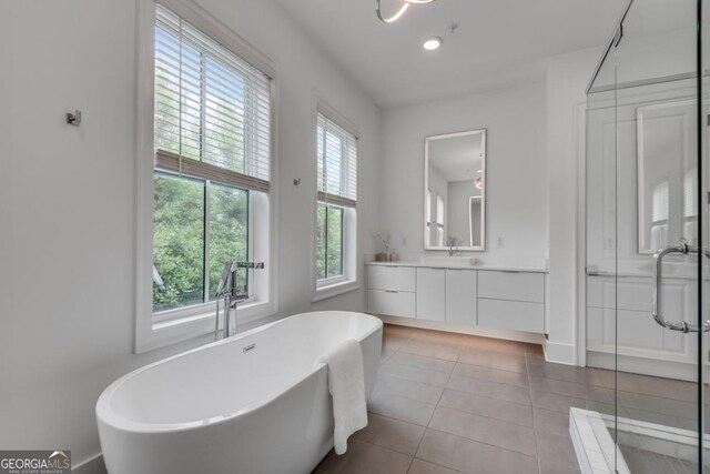 574 Boulevard Pl NE Unit 4, Atlanta, GA 30308 - bathroom with vanity, tile patterned flooring, a freestanding bath, a shower stall, and recessed lighting