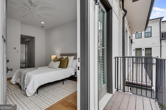 574 Boulevard Pl NE Unit 4, Atlanta, GA 30308 - bedroom featuring wood finished floors and brick wall
