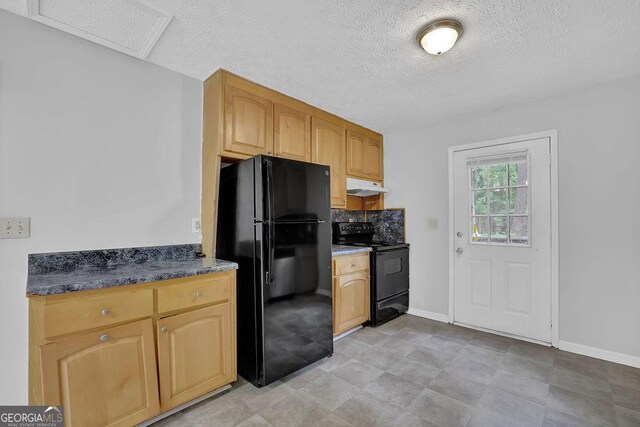 361 Gordon Valley Ln SW, Mableton, GA 30126 - kitchen with black appliances, under cabinet range hood, a textured ceiling, baseboards, and dark countertops