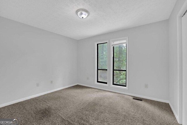 361 Gordon Valley Ln SW, Mableton, GA 30126 - empty room featuring carpet, a textured ceiling, and baseboards