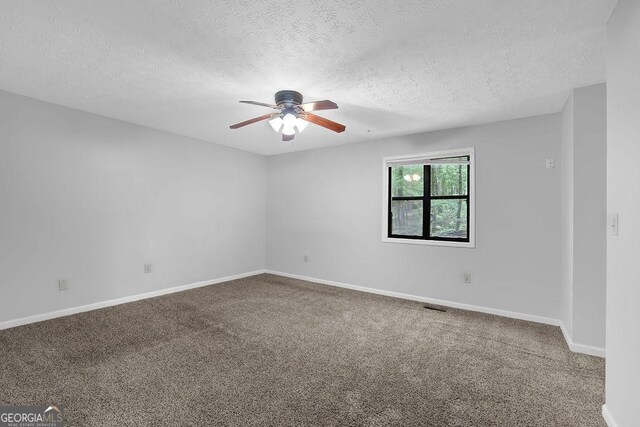 361 Gordon Valley Ln SW, Mableton, GA 30126 - carpeted empty room with a ceiling fan, a textured ceiling, and baseboards