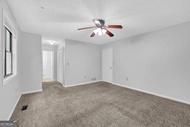361 Gordon Valley Ln SW, Mableton, GA 30126 - carpeted spare room with a textured ceiling, ceiling fan, and baseboards