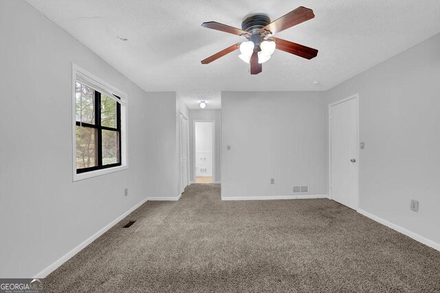 361 Gordon Valley Ln SW, Mableton, GA 30126 - carpeted empty room with a ceiling fan, a textured ceiling, and baseboards