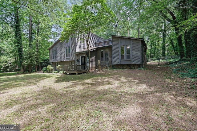 361 Gordon Valley Ln SW, Mableton, GA 30126 - rear view of house with fence and a wooden deck