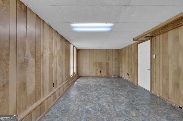 361 Gordon Valley Ln SW, Mableton, GA 30126 - spare room featuring a paneled ceiling, wood walls, and baseboards