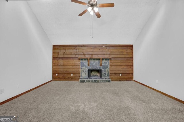 361 Gordon Valley Ln SW, Mableton, GA 30126 - unfurnished living room with ceiling fan, lofted ceiling, wooden walls, a fireplace, and carpet floors