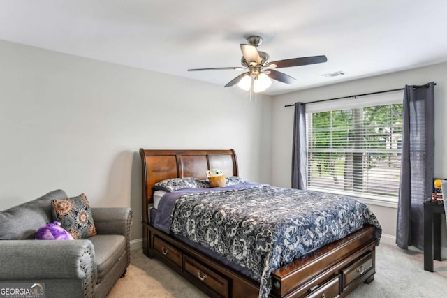 bedroom with light carpet, baseboards, and ceiling fan