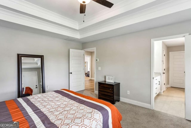 bedroom featuring light colored carpet, ornamental molding, a raised ceiling, and baseboards