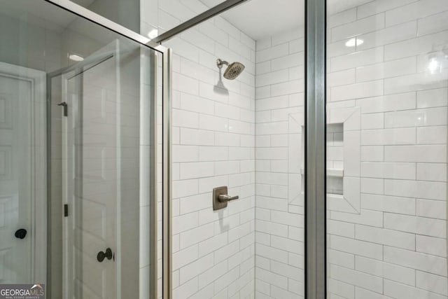 full bath featuring a shower stall